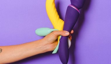 hand holding sex toys