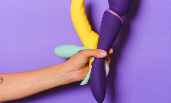 hand holding sex toys