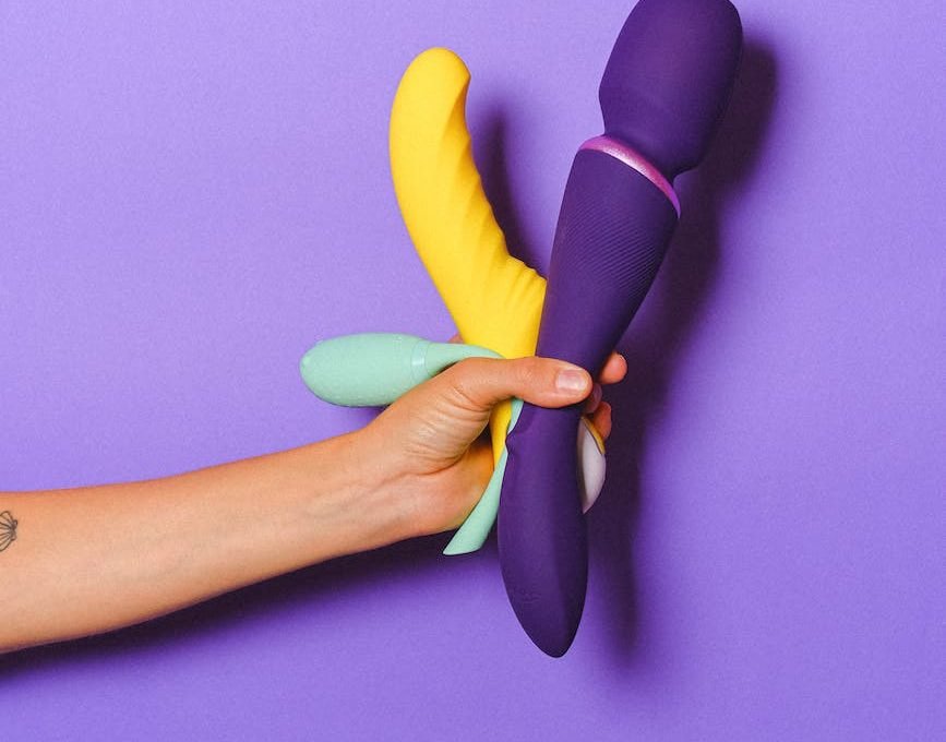 hand holding sex toys