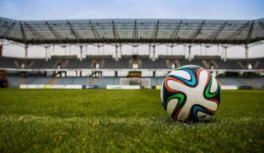 soccer ball on grass field during daytime