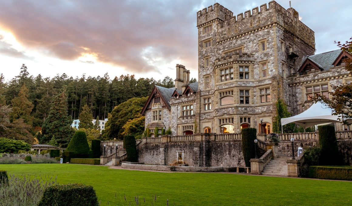 stone castle with green grass front yard