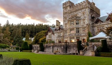 stone castle with green grass front yard